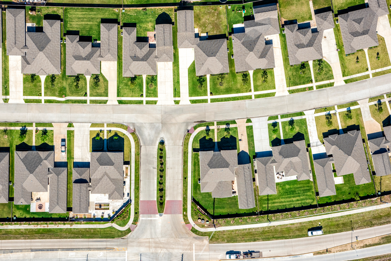 A large group of middle class homes in a suburban Houston, Texas neighborhood shot from an altitude of about 1000 feet.